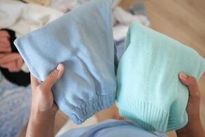 Efficiently Sorting Colorful Sweaters and Pants for Better Organization photo