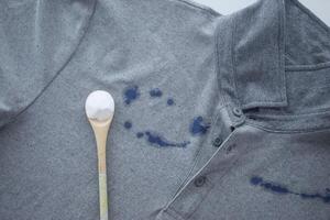 Baking soda on a shirt stain by ink photo
