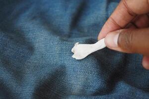 Detailed instructions for effectively removing chewing gum from fabric, with closeup view focus photo
