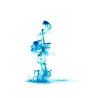 Blue ink dropped in to water isolated white background. Abstract color dissolving in water photo