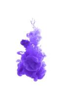 Purple ink dropped in to water isolated white background. Abstract color dissolving in water photo
