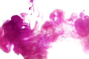 Pink ink dropped in to water isolated white background. Abstract color dissolving in water photo