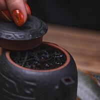 Experience an elegant tea ceremony with a beautifully crafted traditional teapot photo