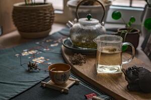 Elegant Tea Ceremony Featuring a Beautiful Teapot and Lovingly Arranged Natural Elements photo