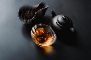 Enjoy a beautiful tea pot and infused leaves for a relaxing and comfy tea ritual photo