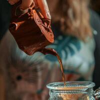 Experience the art of Traditional Tea Pouring from a beautifully handcrafted Clay Pot photo