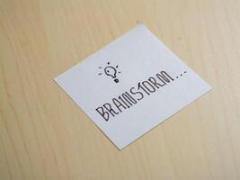 Brainstorming ideas for creative projects office space note-taking indoor close-up innovation photo