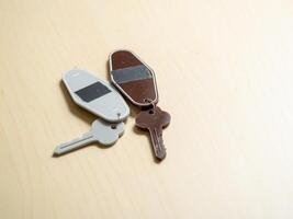 Key collection on wooden surface home minimalist elevated view everyday objects photo