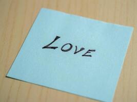 Love note home office desk personal message minimalist environment close-up view emotion expression photo