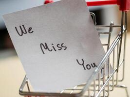 Shopping cart note a message of remembrance in a store environment personal touch emotional context photo