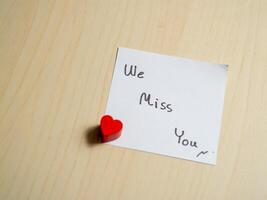 Heartfelt message home desk note personal space close-up connection and longing photo