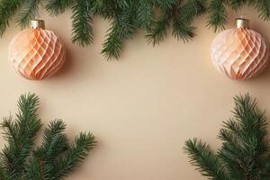 Christmas background with honeycomb balls and fir branches creating a festive frame on beige backdrop photo