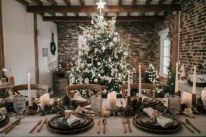 Christmas table setting decorated with candles, pine cones, and greenery in front of christmas tree photo