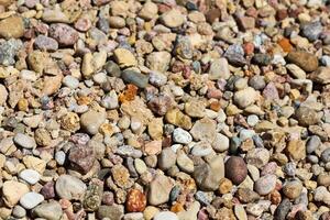 Various gravel pile for background. Sharp closeup stones for construction. Rubble texture photo