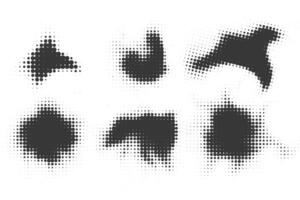 Halftone dotted shapes on white background. Paint blob with noisy effect. Abstract splatter stroke shapes. vector