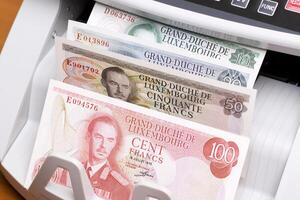 Luxembourg franc in the counting machine photo