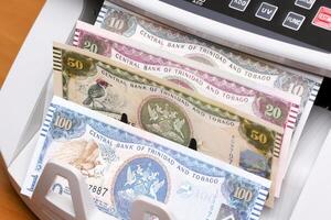 Trinidad and Tobago dollar in the counting machine photo