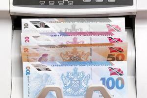 Trinidad and Tobago dollar in the counting machine photo