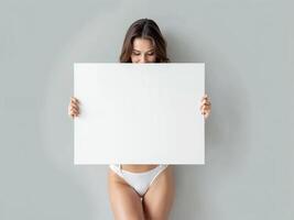 Minimalist composition of a woman holding a blank white board in a bright setting, perfect for mockups and branding visuals photo