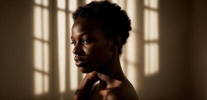 A woman with dark skin and a black background photo