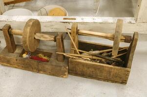 Traditional wool spinning tools and yarn display in rustic workshop setting photo