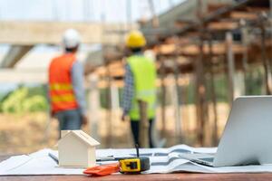 inspector engineer and owner project is inspecting construction and quality assurance new house. Engineers or architects or contactor work to build the house before handing it over to the homeowner photo