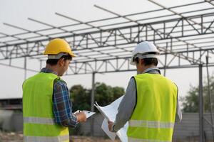 inspector engineer and owner project is inspecting construction and quality assurance new house. Engineers or architects or contactor work to build the house before handing it over to the homeowner photo