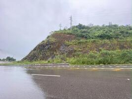 A road with a hill in the background photo