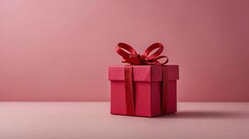 Pink gift box with red ribbon surrounded by roses and red heart shapes on a gradient pink background, concept of romance. Valentines day photo