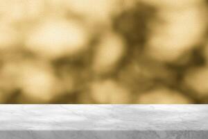 Empty Marble Table with Gold Bokeh on Concrete Wall Background for Product Presentation. photo