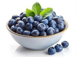 Fresh and juicy blueberry on a plate, isolated on white photo