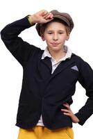 Portrait of a funny boy in a vintage cap on a white background. photo