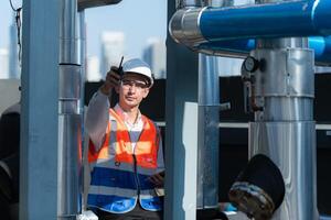 Engineers inspect the completed air conditioning and water systems to continue verifying their functionality. photo