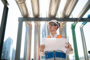 Engineers inspect the completed air conditioning and water systems to continue verifying their functionality. photo
