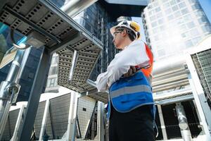 Engineers inspect the completed air conditioning and water systems to continue verifying their functionality. photo
