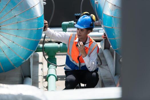 Engineers inspect the completed air conditioning and water systems to continue verifying their functionality. photo
