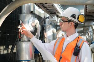 Engineers inspect the completed air conditioning and water systems to continue verifying their functionality. photo