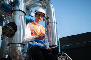 Engineers inspect the completed air conditioning and water systems to continue verifying their functionality. photo