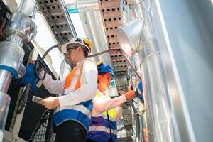 Engineers and technicians Inspect the completed air conditioning and water systems to continue verifying their functionality. photo