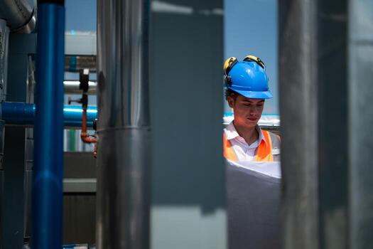Engineers inspect the completed air conditioning and water systems to continue verifying their functionality. photo