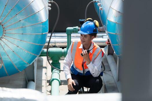 Engineers inspect the completed air conditioning and water systems to continue verifying their functionality. photo