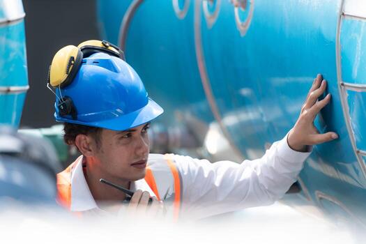 Engineers inspect the completed air conditioning and water systems to continue verifying their functionality. photo