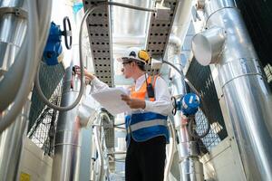 Engineers inspect the completed air conditioning and water systems to continue verifying their functionality. photo