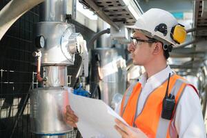 Engineers inspect the completed air conditioning and water systems to continue verifying their functionality. photo