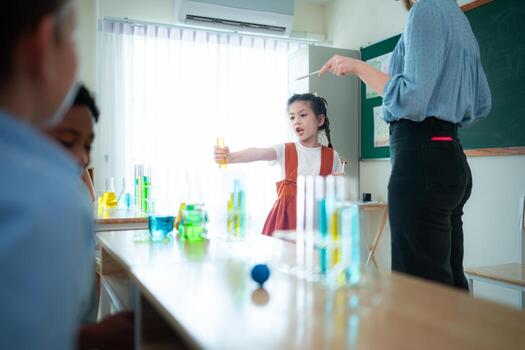 Teacher and students, Learn and experiment with science in a school science classroom. photo