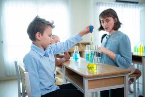 Teacher and students, Learn and experiment with science in a school science classroom. photo