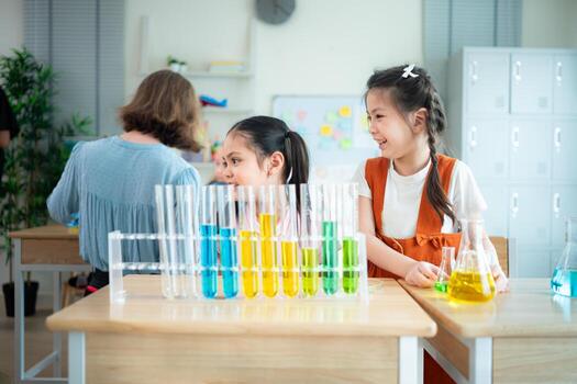 Teacher and students, Learn and experiment with science in a school science classroom. photo