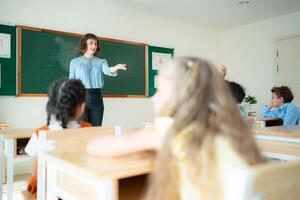 Teacher and students, Learn and study in a classroom of school where youngsters sit and listen attentively. photo