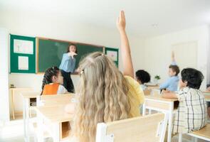 Teacher and students, Learn and study in a classroom of school where youngsters sit and listen attentively. photo
