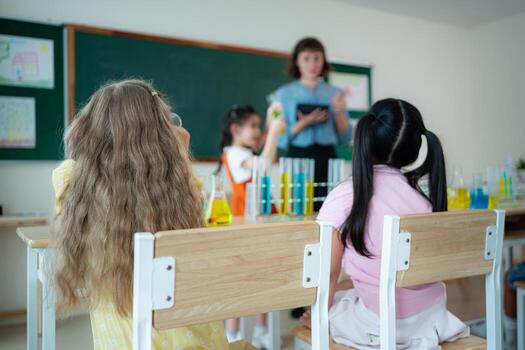 Teacher and students, Learn and experiment with science in a school science classroom. photo